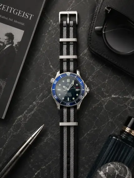 Bond NATO strap, black and grey striped, by vild Hamburg, on an Omega Seamaster Professional 300M Ref. 2531.80.00, photographed decoratively from above.