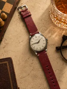 Vintage cognac leather strap from vild Hamburg, mounted on an IWC Cal 853 and photographed decoratively from above.