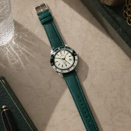 Green leather strap from vild Hamburg, mounted on a Grand Seiko Sport GMT and photographed decoratively from above.