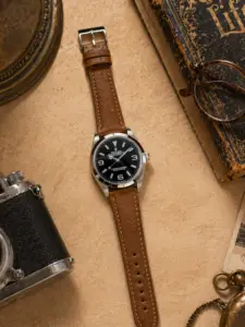 Khaki leather strap by vild Hamburg, mounted on a Rolex Explorer and shown from above with matching decoration