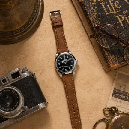 Khaki leather strap by vild Hamburg, mounted on a Rolex Explorer and shown from above with matching decoration