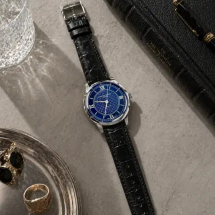 Crocodile leather strap in black by vild Hamburg, mounted on a Frederique Constant Classics watch and shown decoratively from above.