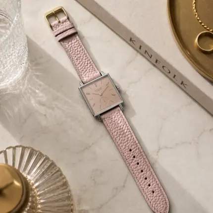 Pink leather bracelet by vild Hamburg, mounted on a NOMOS Tetra and shown decoratively from above.