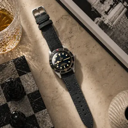 Dark grey suede strap by vild Hamburg, mounted on a Tudor Black Bay Fifty-Eight and shown decoratively from above.