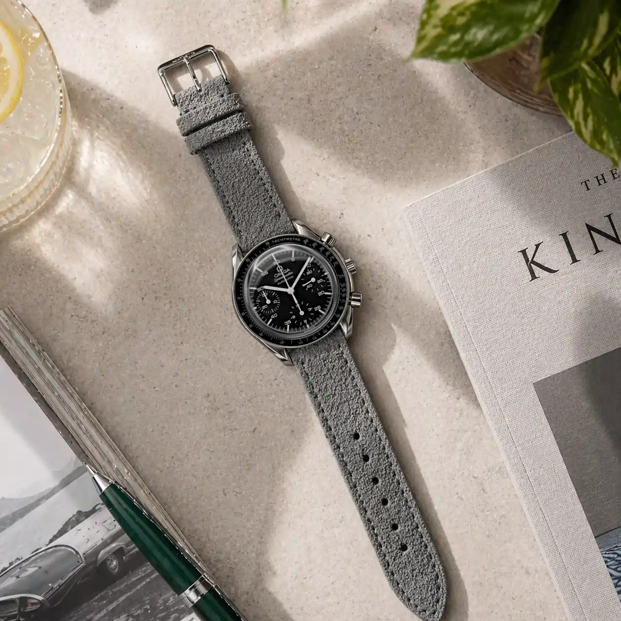 Grey suede strap by vild Hamburg, mounted on an Omega Speedmaster Reduced and shown from above with decoration