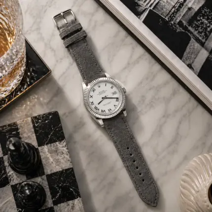 Grey suede strap from vild Hamburg, mounted on a Rolex Datejust 41 and photographed decoratively from above.