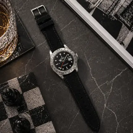 Black suede strap by vild Hamburg, mounted on a Rolex Explorer II and shown from above with matching decoration