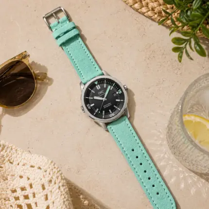 Turquoise suede strap from vild Hamburg, mounted on an IWC Aquatimer and photographed decoratively from above.