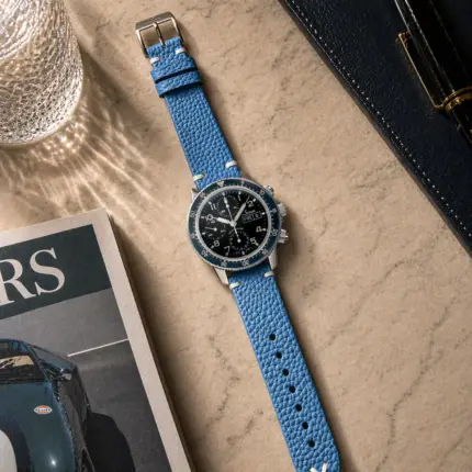 Vintage blue leather strap from vild Hamburg, mounted on a Sinn 103 and shown from above with decoration