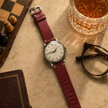 Vintage cognac leather strap from vild Hamburg, mounted on an IWC Cal 853 and photographed decoratively from above.