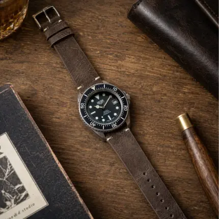 Vintage leather Espresso strap by vild Hamburg, mounted on a Heuer Professional and shown from above with decoration
