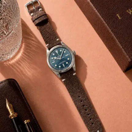 Vintage dark brown suede strap from vild Hamburg, mounted on a Tudor Black Bay 39 and photographed from above with decoration