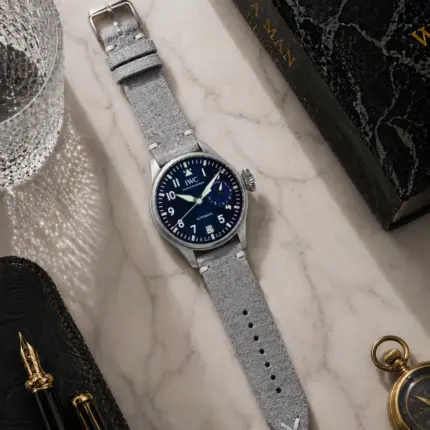 Vintage grey suede strap from vild Hamburg, mounted on an IWC Big Pilot's Watch and photographed from above with matching decoration