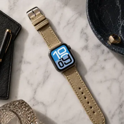 Apple Watch Canvas Band beige by vild Hamburg, mounted on the watch and photographed from above with matching decoration