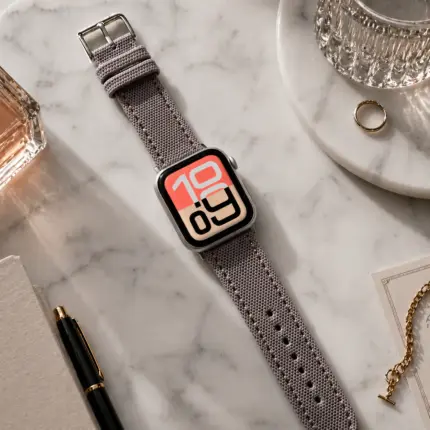 Apple Watch Canvas Band grey beige by vild Hamburg, mounted on the watch in a decorated top view.