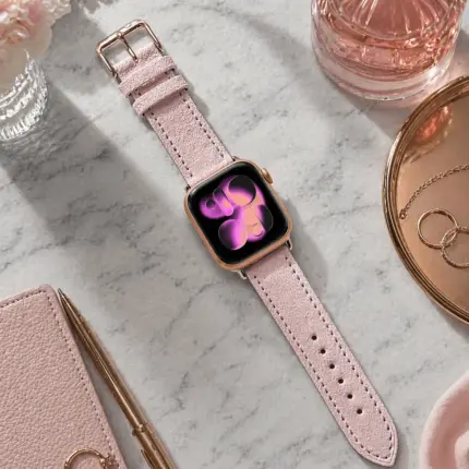 Apple Watch suede strap in pink by vild Hamburg, mounted on the watch and photographed from above with matching decoration