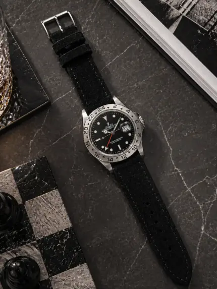 Black suede strap by vild Hamburg, mounted on a Rolex Explorer II and shown from above with matching decoration