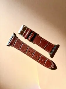 Apple Watch crocodile leather watch strap, brown, in sunlight against a colored background by vild Hamburg