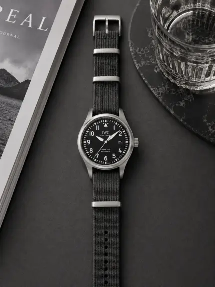 Dark grey premium NATO strap from vild Hamburg, mounted on an IWC Pilot's Watch Mark XVIII and photographed from above with matching decoration