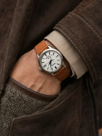 Mahogany suede watch strap in warm brown worn on a Grand Seiko