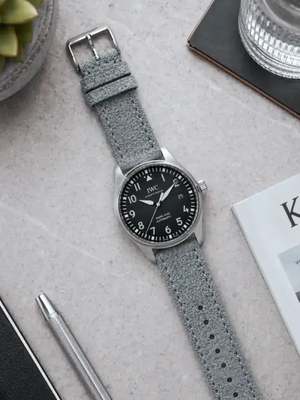 Suede strap, grey and blue, by vild Hamburg, mounted on an IWC Pilot's Watch Mark XVIII and photographed from above.