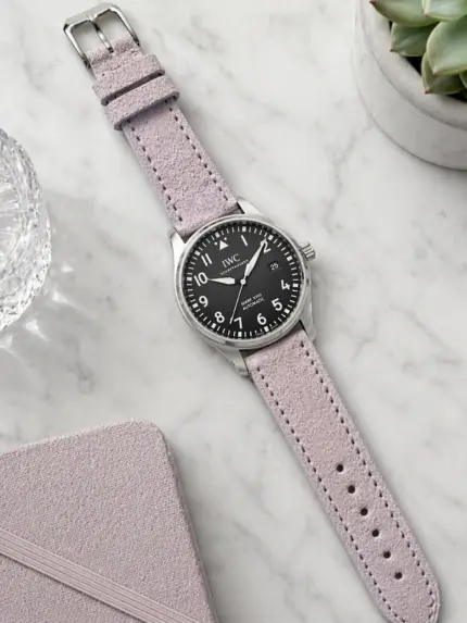 Lilac suede strap from vild Hamburg, mounted on an IWC Pilot's Watch Mark XVIII and photographed from above with decoration