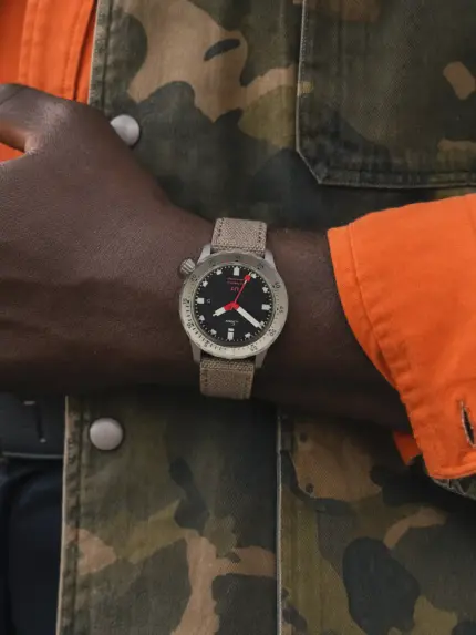 Grey-beige MOUNT canvas watch strap worn on a Sinn U1 on the wrist