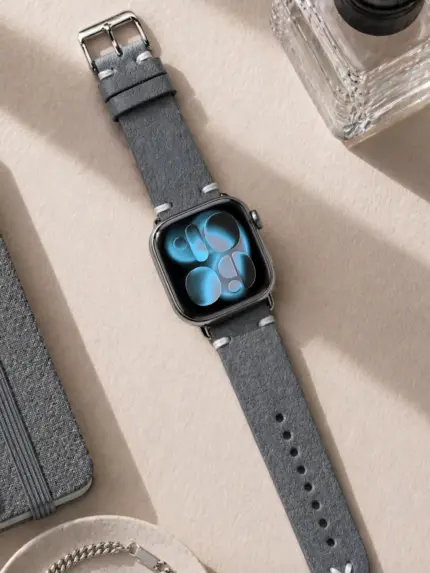 Apple Watch vintage grey leather strap from vild Hamburg, mounted on the watch and photographed from above with matching decoration