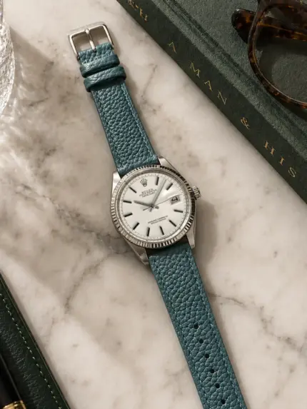 Petrol leather strap by vild Hamburg, mounted on a Rolex Datejust and photographed from above with decoration